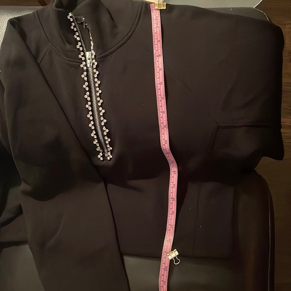 Black top could be a turtle neck with rhinestones zip up
